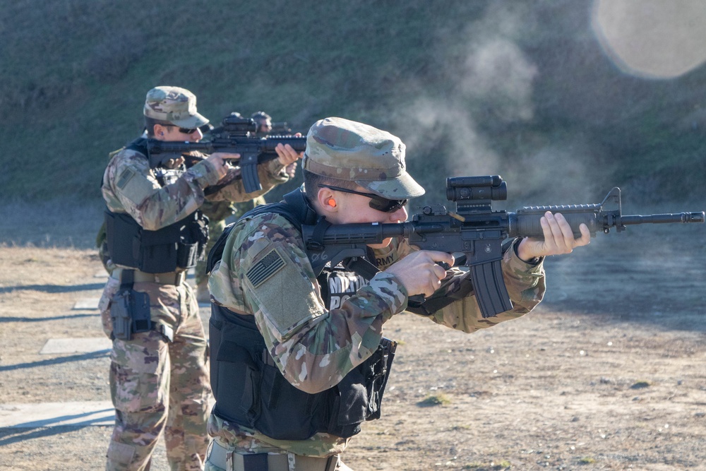Spc. James Courser (right) and Pfc. George Nichols fire M4 carbines at a joint U.S.&ndash;Canadian range, Mihail Kogălniceanu, Romania, December 2019